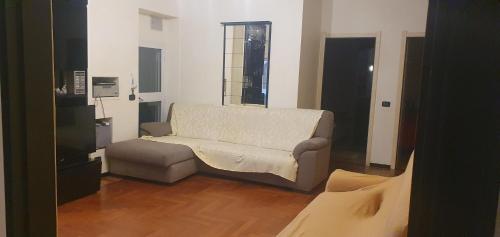 a living room with a couch in a room at SESTRI Villa Vignolo with POOL in Sestri Levante