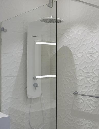 a shower with a glass door in a bathroom at The Originals Hôtel Le Cise Restaurant Chambres et Suites in Ault