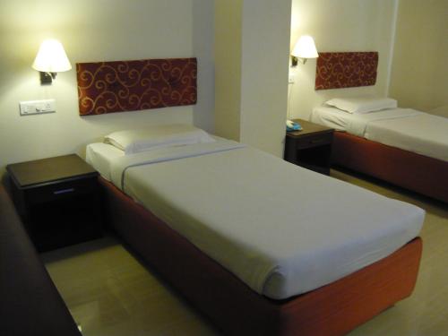 Postel nebo postele na pokoji v ubytování Hotel Malainn