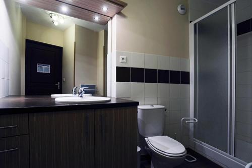 a bathroom with a toilet and a sink and a shower at Résidence Serias - T2/6pers SERIAS 32- Peyresourde MAE-3514 in Germ