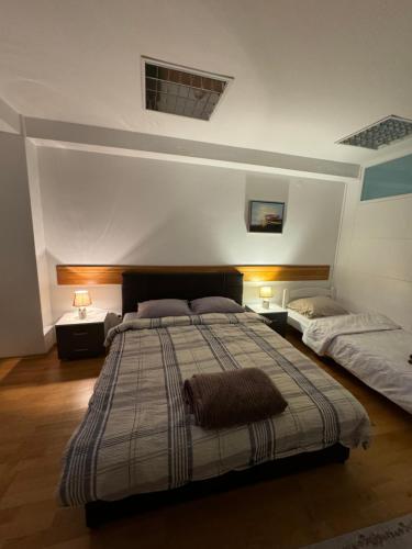 Кровать или кровати в номере ARG Apartment Sarajevo