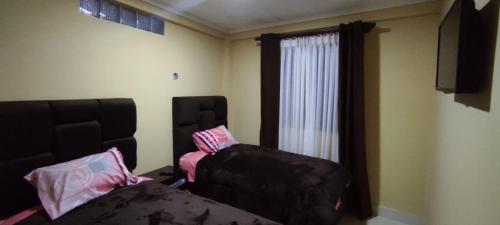 Posteľ alebo postele v izbe v ubytovaní Hostal Cadena