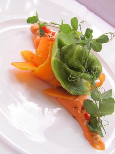 a white plate of food with carrots and green peppers at Gastwirtschaft & Hotel Holzinger in Möllersdorf