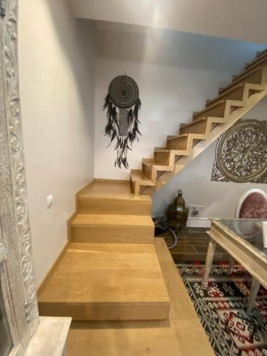 a staircase in a home with wooden floors at Casa Cruz in Gelves