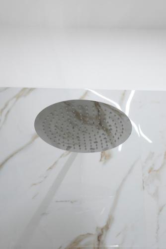 a shower head sitting on top of a counter at MarGab B&B in Naples