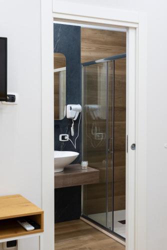 a bathroom with a shower and a sink at MarGab B&B in Naples