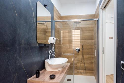 a bathroom with a sink and a shower at MarGab B&B in Naples