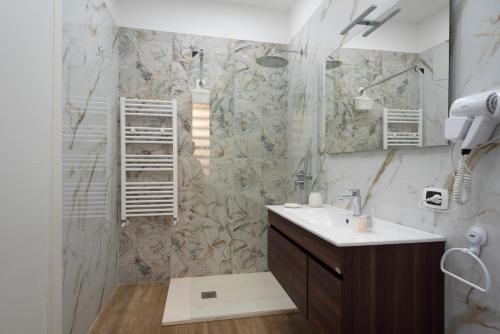 a bathroom with a sink and a shower at MarGab B&B in Naples