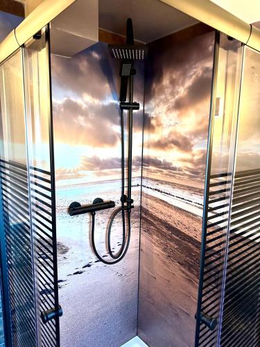 a shower with a view of the beach at Pension Victoria Halberstadt in Halberstadt
