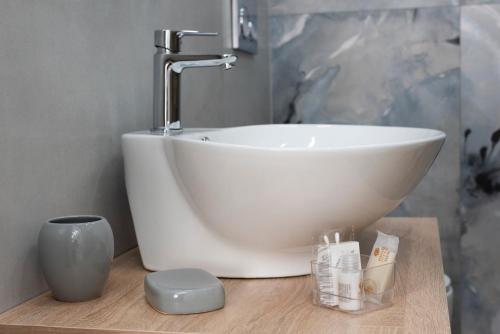a white sink sitting on a counter in a bathroom at MarGab B&B in Naples