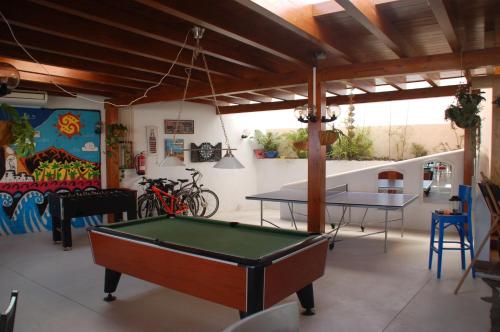 a room with two tables and a pool table at HOTELITO RURAL GA7COLORES only adult in Montaña Blanca