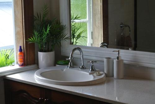a white sink in a bathroom with a window at Ocean Serenity in Mission Beach