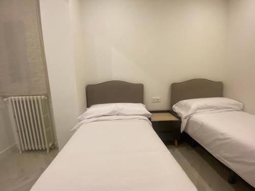 Uma cama ou camas num quarto em Apartamento Domus