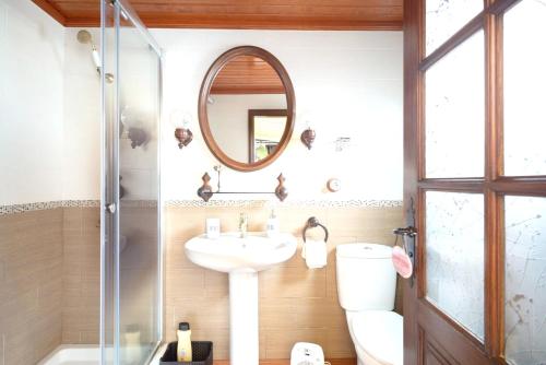 a bathroom with a sink and a mirror at 5 bedrooms chalet with wifi at Firgas in Firgas