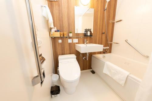 a small bathroom with a toilet and a sink at Light Hotel - Vacation STAY 91078v in Tokyo