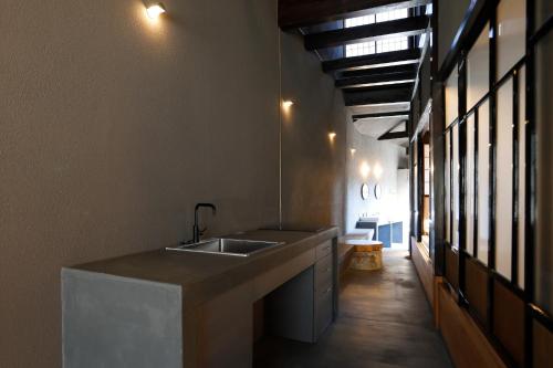 a kitchen with a sink and a counter top at sou's minka Luru - Vacation STAY 62536v in Minamiechizen