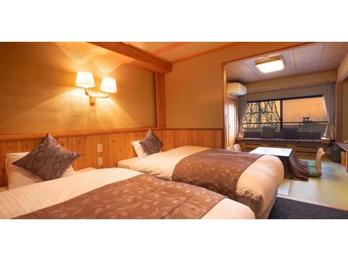 เตียงในห้องที่ Ougatou Hotel - Vacation STAY 32141v