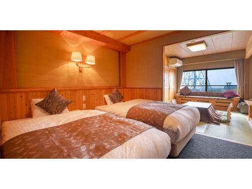a hotel room with two beds and a window at Ougatou Hotel - Vacation STAY 32141v in Nagawa