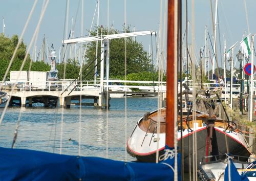 a group of boats docked in a marina at Waterland Vakantiehuis in Monnickendam