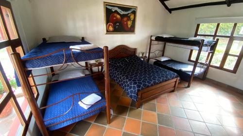 Postel nebo postele na pokoji v ubytování Finca-Hotel Villa Mariana en Boyacá