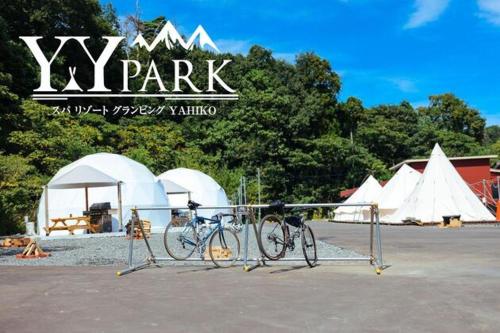 two bikes parked in a parking lot with tents at YahikoYYPark - Vacation STAY 80769v 