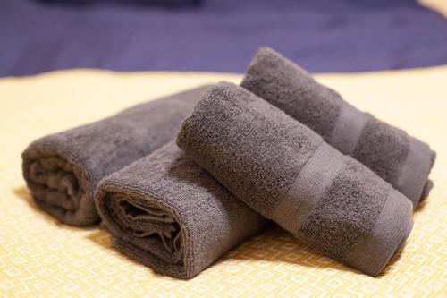 a towel on a bed with a sock on it at Lucky Higashi Mizue - Vacation STAY 16180 in Tokyo