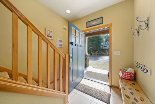a hallway with a glass door leading to a staircase at Sandpiper House-Manzanita Or in Manzanita
