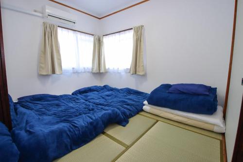 Kurokawa Building No, 201 - Vacation STAY 16198 tesisinde bir odada yatak veya yataklar