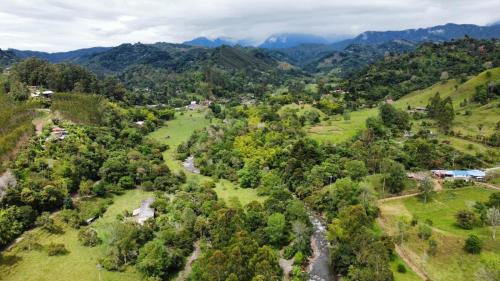an aerial view of a village in the mountains at chez yannick Hospadaje Los Amigos in Salento