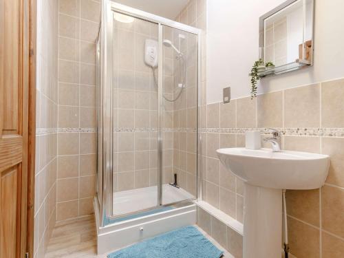a bathroom with a shower and a sink at 1 Bed in Sennen CLOPC in St Just