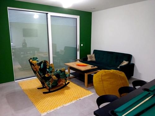 a living room with a couch and a table at Dom Bilardowy przy trasie A4 Gliwice Żernica 110m2 