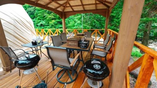 a gazebo with a table and chairs on a deck at Riverside Glamping Nuts - Vacation STAY 84738v in Komono