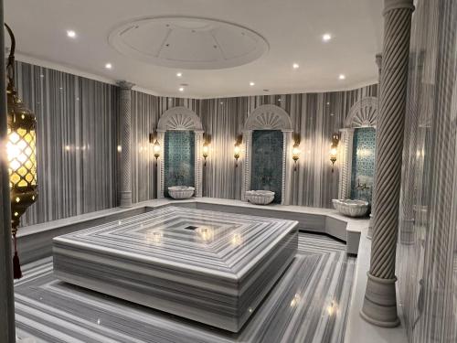 a room with a large tub in the middle of it at 4Seasons Ciprus 1+1 in Boğaz