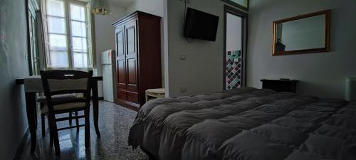 מיטה או מיטות בחדר ב-affittacamere Monte inni