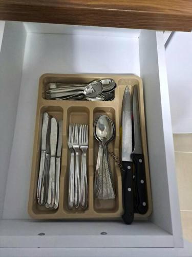 a tray with utensils in a drawer at White House Apartments - Boho in Haskovo