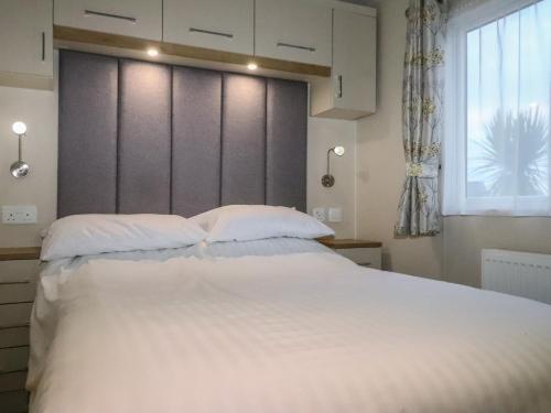 מיטה או מיטות בחדר ב-Seaviews