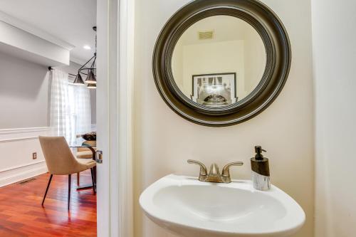 a bathroom with a sink and a mirror at Charming Baltimore Getaway about 1 Mi to Downtown! in Baltimore