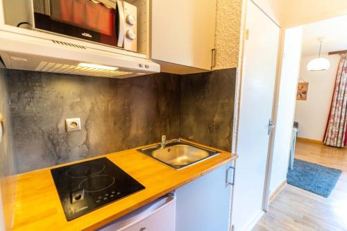 Kjøkken eller kjøkkenkrok på Résidence Le 1650 - Studio 834