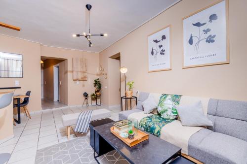 a living room with a couch and a table at Sarita's Apartments & Suite in Laganas