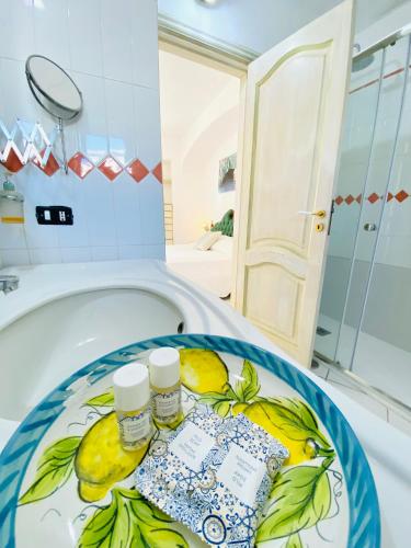 a bath tub with two bottles of medicines on it at Casa Pippo 2 in Anacapri