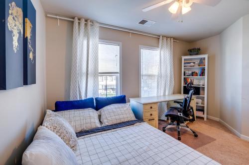 a bedroom with a bed and a desk at Spacious Woodbridge Home Near Leesylvania Park! in Woodbridge