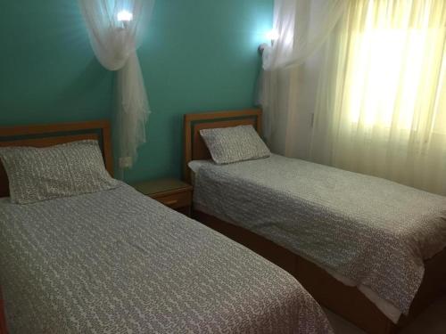 Postel nebo postele na pokoji v ubytování Sharks Bay Oasis Apartment Sharm El sheik