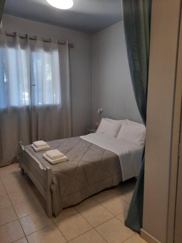 Ένα ή περισσότερα κρεβάτια σε δωμάτιο στο Vivian Villa