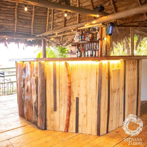 a bar made out of a wooden wall at Nirvana Resort in Lívingston
