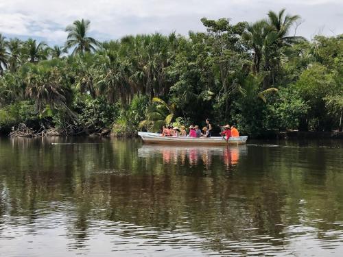 a group of people in a boat on a river at Hab #4 La Casa Del Profe Salo in Santa María Tonameca