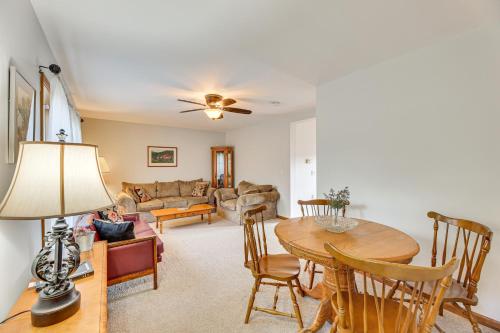 a living room with a table and a couch at McDowell Highland County River Retreat with Views! in Williamsville