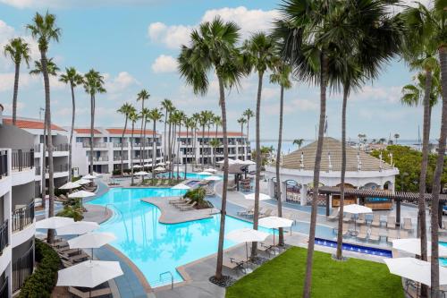 an aerial view of the pool at the resort with palm trees at Loews Coronado Bay Resort in San Diego