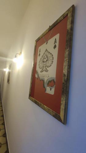 a picture hanging on a wall in a room at Casa Di Mitri in Carini