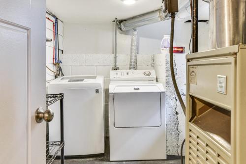 a kitchen with two refrigerators and a washer and dryer at Pet-Friendly Salt Lake City Getaway Near Skiing! in Salt Lake City