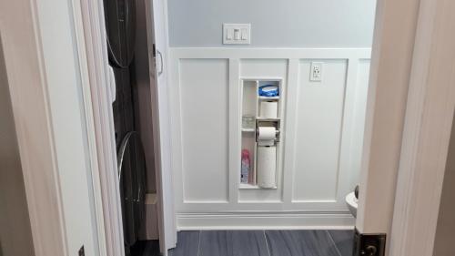 an empty refrigerator with its door open in a room at Home Stay in Atlanta